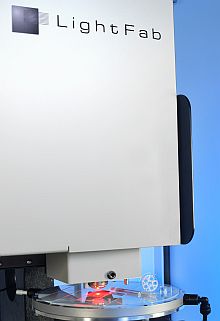 High speed Microscanner with integrated x-y-table, fast focusing and microscope behind the blue sliding door High speed Microscanner with integrated x-y-table, fast focusing and microscope behind the blue sliding door